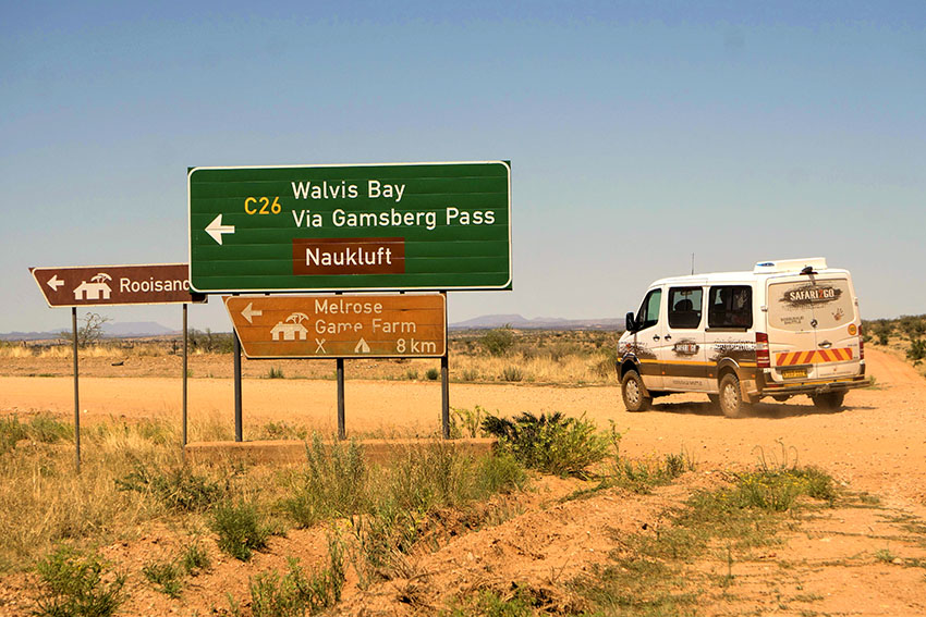 4x4 Midi bus with road signs, rental car, Namibia