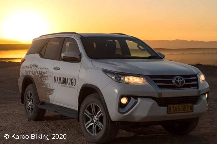 Toyota Fortuner rental car in Namibia at sunset